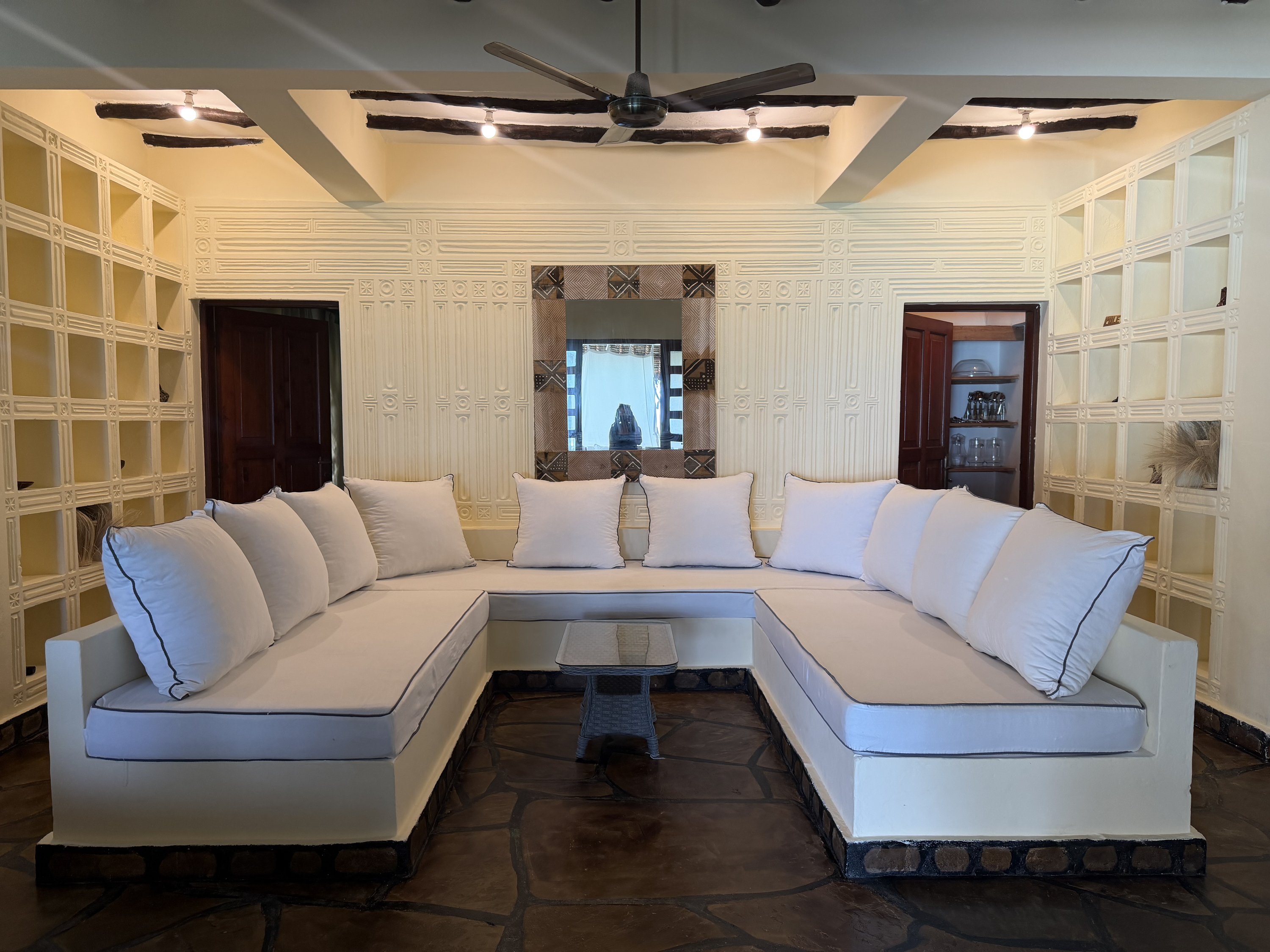 Lounge with built-in daybeds and carved plasterwork