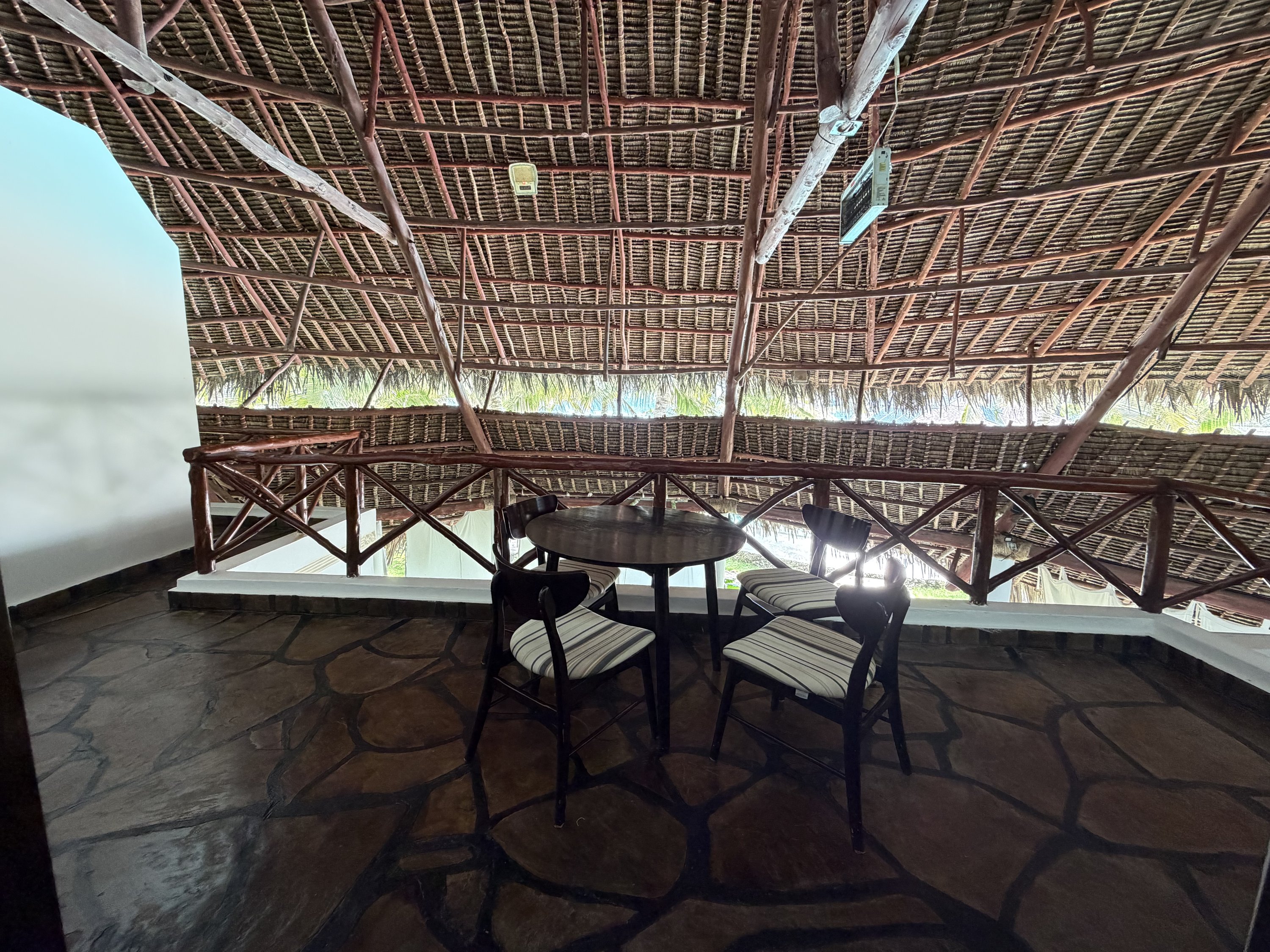 Thatched upper terrace with table
